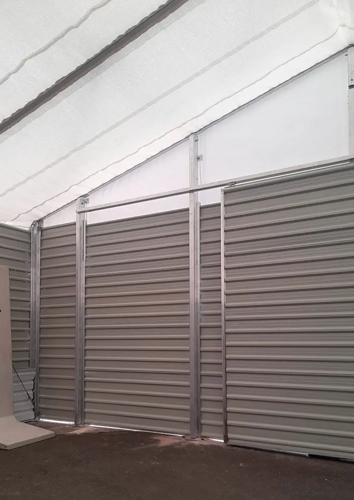 Chapiteau de protection avec porte bardée